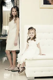 Sisterly Love Images Stampe: Image of elegant sisters posing looking at camera