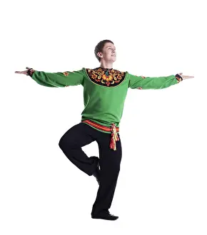 White Background Dance Stampe: Image of smiling folk dancer posing in studio