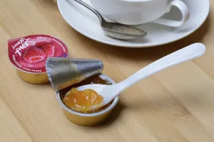 Environmentally Friendly Packaging Stampe: Jam in portion pack with spoon, jam