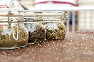Alternative Medicine Tea Stampe: Jars with three different types of tea are on the table