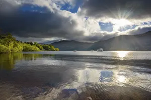Loch Lomond Scotland Stampe: Lake with dramatic clouds and sun in spring