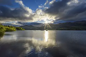 Springtime Landscape Photography Stampe: Lake with dramatic clouds and sun in spring