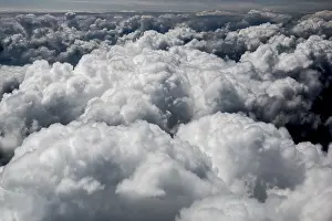 Cloud Formations In Nature Stampe: Large fluffy cumulus clouds, above the clouds
