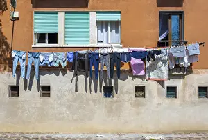 Laundry On Clothesline Stampe: Laundry drying on a clothesline