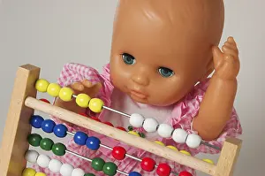 Educational Institution Concept Stampe: Learning arithmetics, doll using an abacus