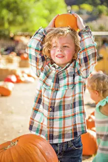 Rustic Ranch Setting Stampe: Little Boy Standing in a Rustic Ranch Setting at the Pumpkin Patch