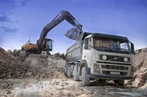 Uninhabited Construction Area Stampe: Loading a large lorry building material