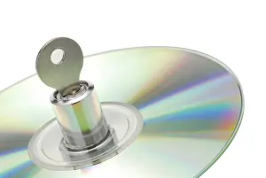 Data Theft Prevention Stampe: Lock with key in a CD