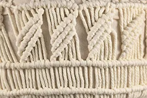 Decorative Embellishment Stampe: Macrame, a form of textile produced using knotting techniques
Macram?
