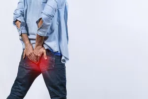 Digestive Issues Stampe: Man with digestive problem touching his buttock