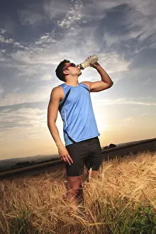Sportsman In Action Stampe: Man jogging through the fields