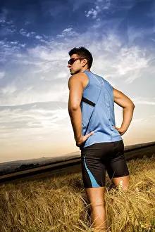 Recreational Activity Photo Stampe: Man jogging through the fields