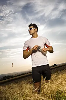 Outdoor Recreational Activity Stampe: Man jogging through the fields