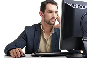 Self Confident Male Stampe: Man looking at a computer screen