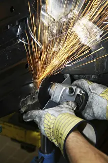 Protective Clothing Detail Stampe: Man working with angle grinder