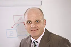 Businessman Suit Stampe: Manager standing in front of a flip chart