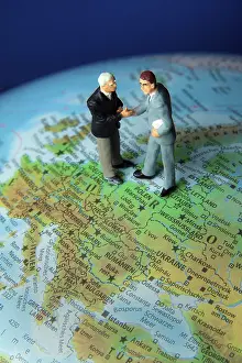 Business Executives Stampe: Two managers on one globe. Globalisation