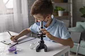 Classroom Education Stampe: Medium shot kid learning with microscope