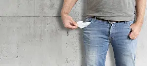Empty Pockets Stampe: midsection of man turning his empty pockets inside out
