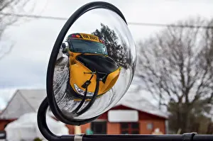 Deserted Public Transport Stampe: Mirroring of the yellow schoolbus on its own external mirror