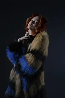 Fashionable Female Stampe: Model stands gracefully in a studio