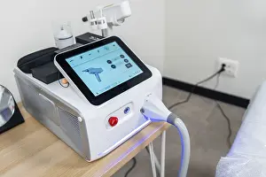 Cosmetic Procedures Stampe: Modern laser machine with a touchscreen interface showcasing its functions