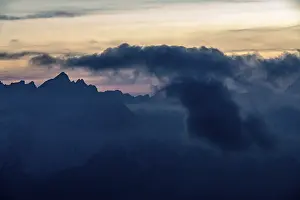 Cloudy Sky Italy Stampe: Mountain top of the Dolomites with dramatic cloudy sky
