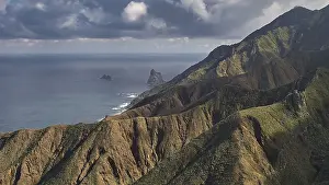 Spanish Mountainous Region Stampe: Mountain landscape with dramatic clouds over the ocean