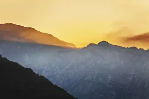 Colourful Evening Atmosphere Stampe: Mountain sunset and colored sky with clouds