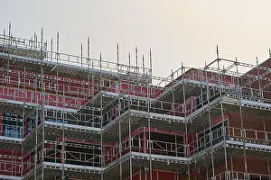 Construction Work In Europe Stampe: Multi-storey building under construction