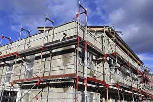 Single Family Home Construction Stampe: New building with completed basic rendering of the exterior facade New building with completed basic rendering of