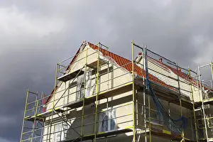 Single Family Home Construction Stampe: New building with completed basic rendering of the exterior facade New building with completed basic rendering of