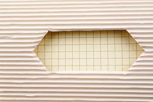 White Isolated Studio Photography Stampe: Notebook and a Cut out paper with pattern on a white background