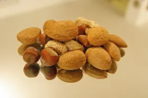 Studio Shot Of Nuts Stampe: Nuts on a mirror