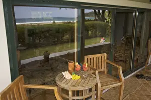 Deserted Beach Scenery Stampe: Oceanfront lanai with reflection of view