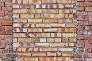 Old Brick Wall Texture Stampe: Old brick wall background texture with a window covered by different bricks