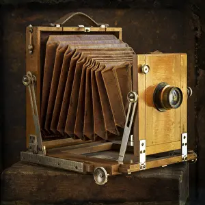 Old Camera Stampe: Old camera on brown background