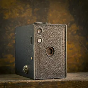 Old Camera Stampe: Old camera on brown background