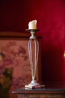 Red Background Image Stampe: Old candlestick in front of red background