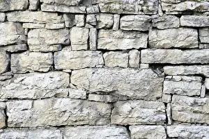 Historic Stone Structure Stampe: Old stone wall out of shell limestone