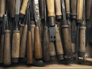Handmade Goods Stampe: Old used chisel in a workbench drawer