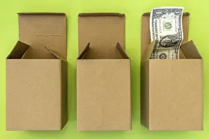 US Dollar Note Picture Stampe: Three open boxes and dollar bulging out of one of them