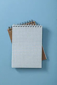 Office Supply Images Stampe: Two Opened Note Pads On Blue Background
