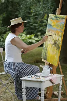 Female Artist Stampe: Painter in front of her easel