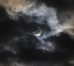 Cloudy Sky Over Europe Stampe: Partial solar eclipse, thin cloud cover