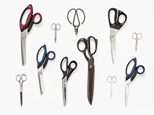 White Background Collage Stampe: Pattern from various scissors on white background