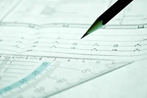Female Architect At Work Stampe: Pencil and set square on a construction plan