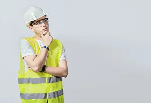 Low Angle View Photography Stampe: A pensive engineer on white background