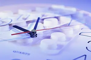 Studio Shot Of Medication Stampe: Pills and clock
