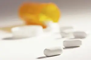 Dramatic Lighting Stampe: Pills and fallen bottle with dramatic lighting